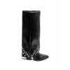 BOTTES HAUTES À RIVETS – MUST-HAVE TENDANCE 2025 POUR UNE GARDE-ROBE STYLÉE