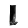 BOTTES HAUTES À RIVETS – MUST-HAVE TENDANCE 2025 POUR UNE GARDE-ROBE STYLÉE