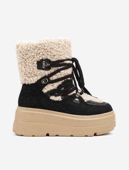 BOTTINES FEMME NOIRES FOURRÉES À LACETS – SEMELLE PLATEFORME CRANTÉE ET COL BOUCLETTE